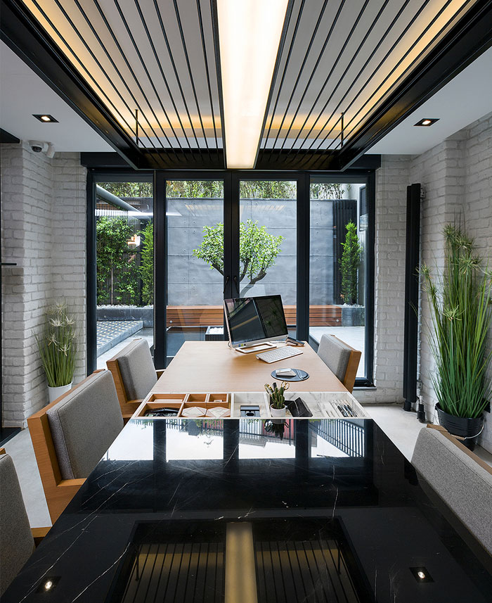 Black and Yellow Emre Group Office Interior - InteriorZine