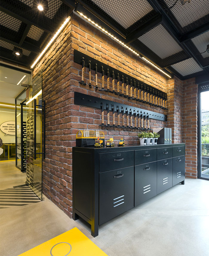 Black and Yellow Emre Group Office Interior - InteriorZine