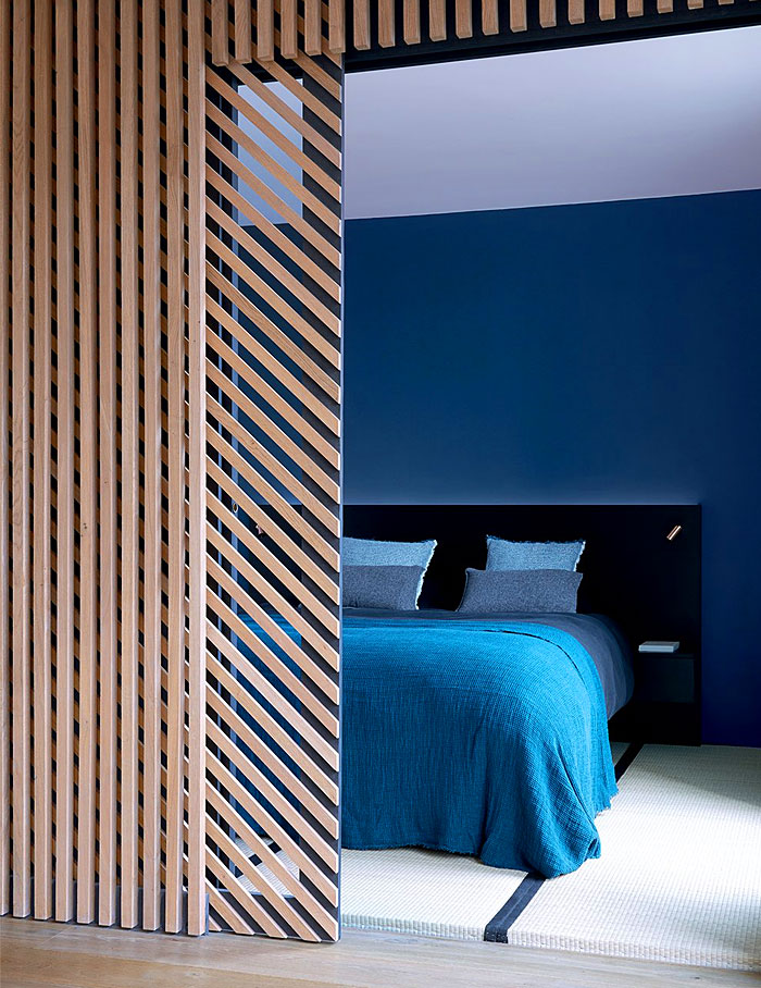 22 Ideas to Hide a Guest Bed hide the bed behind a decorative partition