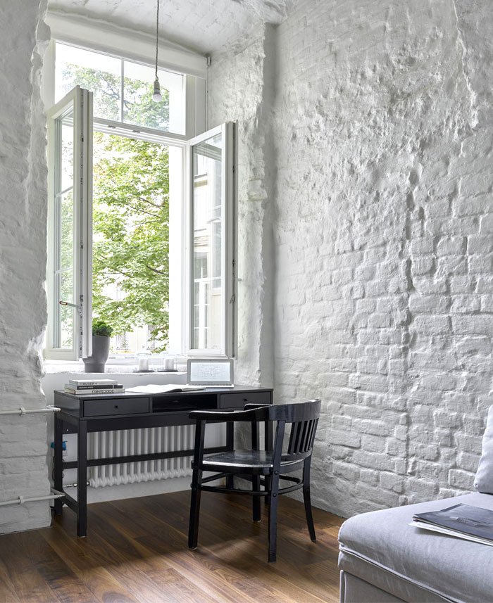 View of Cozy Apartment With Exposed Brick Walls and Arches - InteriorZine