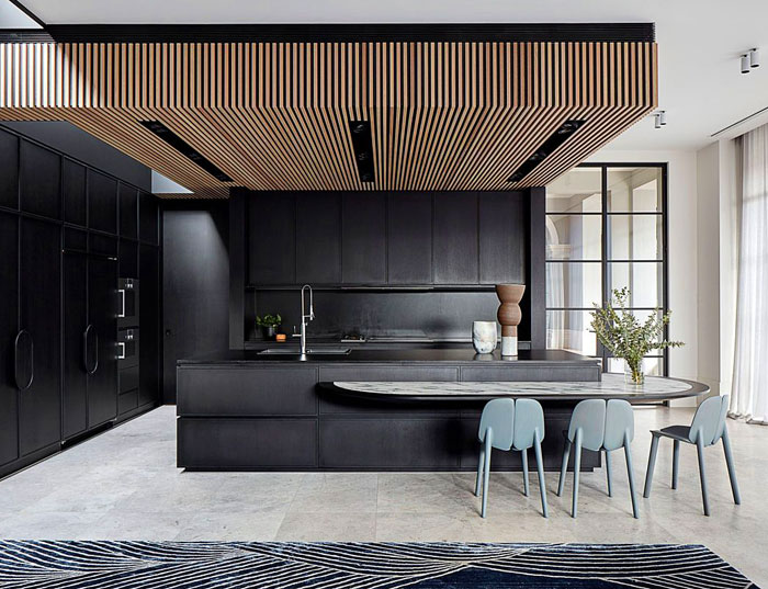 https://www.interiorzine.com/wp-content/uploads/2020/04/natural-wood-ceiling-black-kitchen-2.jpg